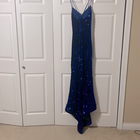 A navy blue prom dress. This is a size 2 from the store MDM. - Picture 2 of 4